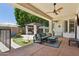 Outdoor patio with seating, fan, desert landscaping, and outdoor kitchen with barbeque at 7032 N 2Nd Ave, Phoenix, AZ 85021