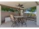 Covered patio featuring an outdoor dining set and a ceiling fan at 7032 N 2Nd Ave, Phoenix, AZ 85021