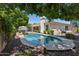 Inviting pool with seating and lush landscaping, perfect for relaxation at 7032 N 2Nd Ave, Phoenix, AZ 85021