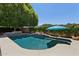 Inviting pool area with lush landscaping and a serene atmosphere at 7032 N 2Nd Ave, Phoenix, AZ 85021
