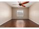 Inviting bedroom offers hardwood floors, window, and a ceiling fan at 716 E Horizon Heights Dr, San Tan Valley, AZ 85143