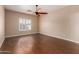 Spacious bedroom features hardwood floors, window, and a ceiling fan at 716 E Horizon Heights Dr, San Tan Valley, AZ 85143