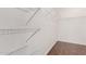 Walk-in closet with wooden floors and wire shelving at 716 E Horizon Heights Dr, San Tan Valley, AZ 85143