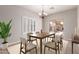 Cozy dining room with bright natural light and seating for six at 716 E Horizon Heights Dr, San Tan Valley, AZ 85143