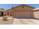 Charming single-story home with a two-car garage and low-maintenance desert landscaping at 716 E Horizon Heights Dr, San Tan Valley, AZ 85143