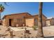 Inviting single-story home with a desert-landscaped front yard and a cozy entryway at 716 E Horizon Heights Dr, San Tan Valley, AZ 85143