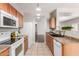 Bright kitchen offers modern appliances, wooden cabinetry, and natural light at 716 E Horizon Heights Dr, San Tan Valley, AZ 85143