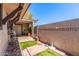 Secluded backyard featuring a mix of pavers and artificial turf, enclosed by a charming privacy wall at 830 S Dobson Rd # 86, Mesa, AZ 85202
