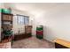 The partially-finished basement offers plenty of storage with shelving and open floor space at 830 S Dobson Rd # 86, Mesa, AZ 85202