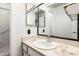 A well-lit bathroom features a marble-style countertop and a clean, functional design at 830 S Dobson Rd # 86, Mesa, AZ 85202