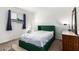 A cozy bedroom features a minimalist style with a plush bed and soft lighting at 830 S Dobson Rd # 86, Mesa, AZ 85202