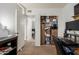A bedroom has an open closet and desk area, making it perfect for storage and office work at 830 S Dobson Rd # 86, Mesa, AZ 85202