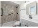 Bathroom featuring shower with glass enclosure, gray vanity and updated fixtures at 8602 N 42Nd Dr, Phoenix, AZ 85051