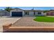 Charming single-story home with well-maintained lawn, desert landscaping, and attached two car garage at 8602 N 42Nd Dr, Phoenix, AZ 85051