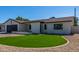 Charming single-story home with well-maintained lawn, desert landscaping, and attached two car garage at 8602 N 42Nd Dr, Phoenix, AZ 85051