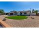 Charming single-story home with well-maintained lawn, desert landscaping, and attached two car garage at 8602 N 42Nd Dr, Phoenix, AZ 85051