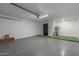 Spacious garage featuring epoxy flooring, and modern lighting at 8602 N 42Nd Dr, Phoenix, AZ 85051