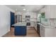 Kitchen with stainless steel appliances, center island, stone countertops and neutral tiling at 8602 N 42Nd Dr, Phoenix, AZ 85051