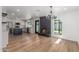 Open-concept living space featuring a fireplace, modern light fixtures, and a stylish kitchen at 8602 N 42Nd Dr, Phoenix, AZ 85051