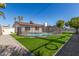 Fenced pool surrounded by artificial grass, offering a safe and attractive backyard feature at 8602 N 42Nd Dr, Phoenix, AZ 85051