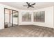 Open and spacious room with sliding glass doors and new carpet at 8725 E Vía Del Arbor --, Scottsdale, AZ 85258
