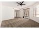 Spacious bedroom with new carpet, ceiling fan, and sliding glass doors at 8725 E Vía Del Arbor --, Scottsdale, AZ 85258