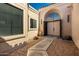 Stylish front entrance features double doors and unique desert landscaping accents at 8725 E Vía Del Arbor --, Scottsdale, AZ 85258