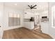 Bright kitchen with modern appliances, granite countertops, and a ceiling fan at 8725 E Vía Del Arbor --, Scottsdale, AZ 85258