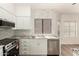 Modern kitchen with marble backsplash, granite counters, and stainless steel appliances at 8725 E Vía Del Arbor --, Scottsdale, AZ 85258