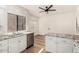 Modern kitchen features granite countertops, stainless steel appliances, and white cabinets at 8725 E Vía Del Arbor --, Scottsdale, AZ 85258