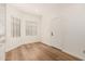 Bright living room with hardwood floors, white walls, and natural lighting at 8725 E Vía Del Arbor --, Scottsdale, AZ 85258