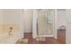 Bathroom featuring a separate shower and tub at 8939 W Villa Rita Dr, Peoria, AZ 85382
