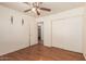 Bedroom with closet, en suite bathroom and wood-look flooring at 8939 W Villa Rita Dr, Peoria, AZ 85382