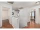 Upstairs hallway features wood-look floors and access to multiple rooms at 8939 W Villa Rita Dr, Peoria, AZ 85382