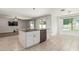Bright kitchen island with granite countertops and stainless steel appliances provides open, eat-in space at 8939 W Villa Rita Dr, Peoria, AZ 85382