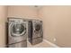 Well-equipped laundry room features a modern washer and dryer set at 8939 W Villa Rita Dr, Peoria, AZ 85382