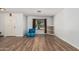 Spacious living room features modern wood-look flooring, abundant natural light, and neutral wall color at 8939 W Villa Rita Dr, Peoria, AZ 85382