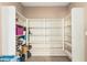 Walk-in pantry featuring lots of shelving space for organized food storage at 8939 W Villa Rita Dr, Peoria, AZ 85382