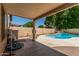 Covered patio provides access to a backyard pool and landscaped yard at 8939 W Villa Rita Dr, Peoria, AZ 85382
