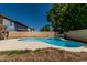 Backyard view of a private pool surrounded by mature trees and block fencing at 8939 W Villa Rita Dr, Peoria, AZ 85382