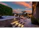 Outdoor oasis with a pool, spa, fire pit and outdoor kitchen, perfect for entertaining at 9255 W Los Gatos Dr, Peoria, AZ 85383