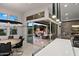 Bright open concept with a dining area and large sliding glass doors to an outdoor kitchen at 9255 W Los Gatos Dr, Peoria, AZ 85383