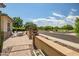 Charming front patio space with seating, a fire pit, and decorative landscaping, offering an inviting outdoor area at 9255 W Los Gatos Dr, Peoria, AZ 85383