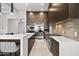 Modern kitchen featuring a large island, stainless steel appliances, and custom cabinetry at 9255 W Los Gatos Dr, Peoria, AZ 85383