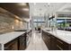 Open-concept kitchen boasts professional-grade appliances, ample counter space, and natural light at 9255 W Los Gatos Dr, Peoria, AZ 85383