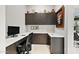 Bright home office with custom built-in cabinetry and desk space, perfect for remote work at 9255 W Los Gatos Dr, Peoria, AZ 85383