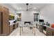 Modern home office with a fireplace, custom built-ins, multiple work spaces, and natural light at 9255 W Los Gatos Dr, Peoria, AZ 85383