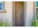 Convenient outdoor shower area with stone finishes and modern fixtures, located near the pool area at 9255 W Los Gatos Dr, Peoria, AZ 85383