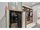Secure walk-in closet with safe, custom shelving, and garment organization at 9255 W Los Gatos Dr, Peoria, AZ 85383