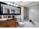 Updated bathroom boasts granite countertops and a tub-shower combination at 10068 E San Salvador Dr, Scottsdale, AZ 85258